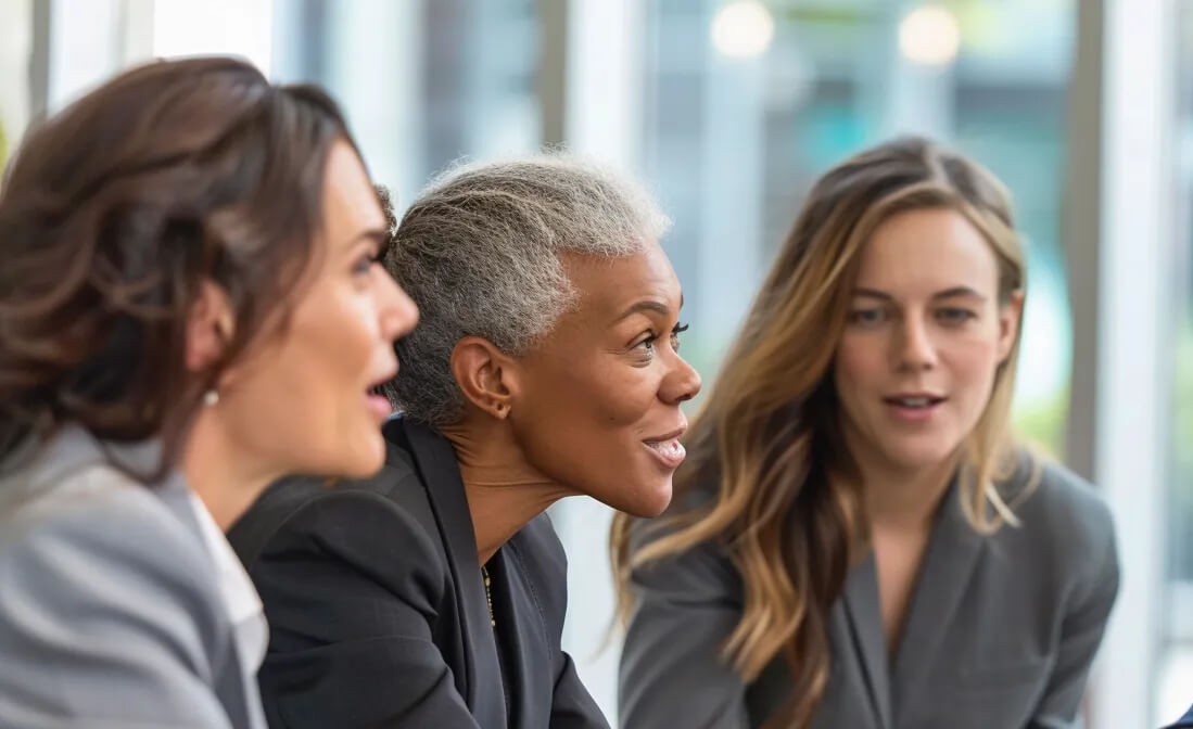 Diverse business team discussing digital solutions, highlighting ETHERFAX vs InterFAX for secure faxing.